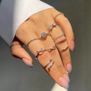 Nihao Wholesale Simple Style Round Infinity Bow Knot Alloy Hollow Out Inlay Rhinestones Women's Rings